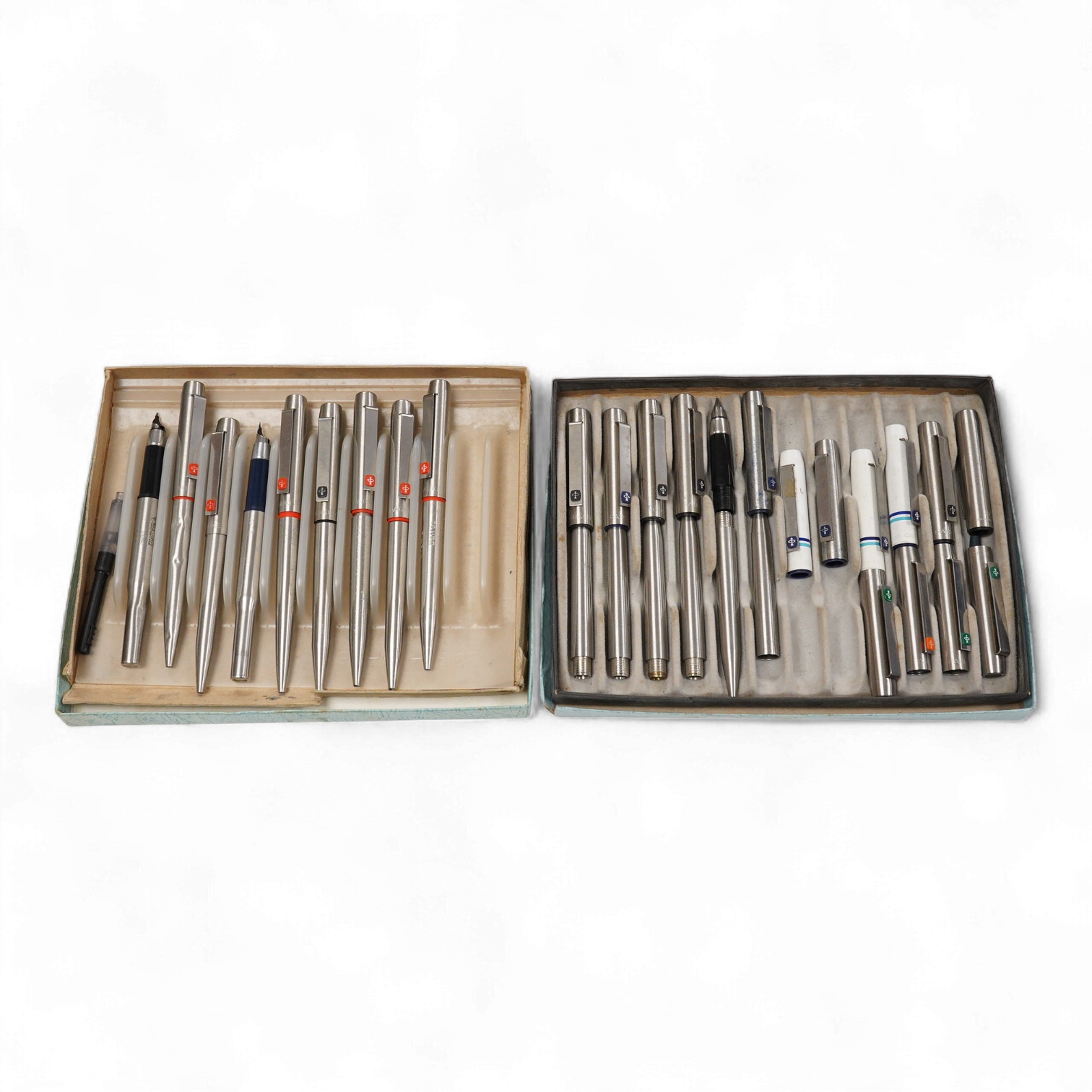 A quantity of Parker 25 fountain pens and ballpen spares including rare orange parts